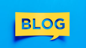 Blog written in yellow word box over blue background