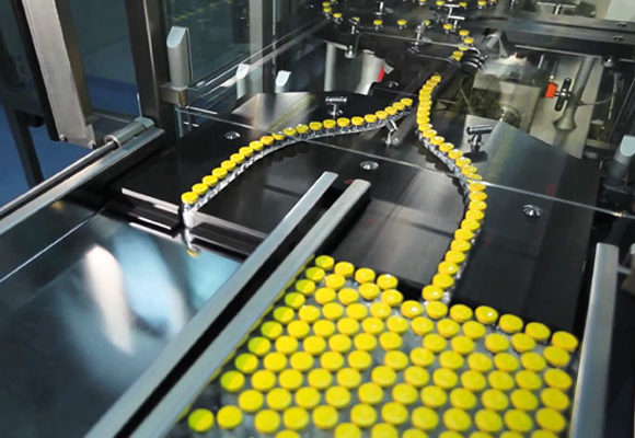 Order, Automated line separating bottles with yellow tops from filling/capping line
