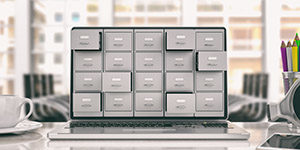 Digital file organization, laptop shown with 5 stacks of file cabinets filling screen