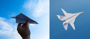Paper airplane being ready to be thrown next to image of origami fighter plane