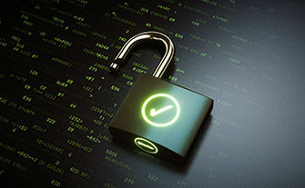 Open green padlock with lit check mark on it sits over surface filled with computer code