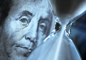 Middle of hourglass looked at by Ben Franklin $100 Bill image
